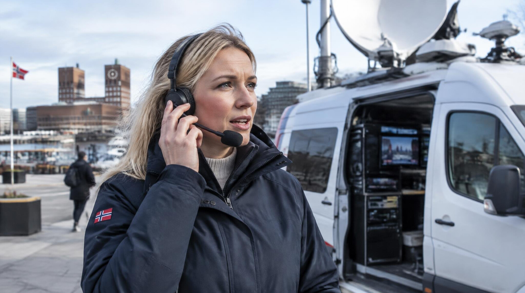 Field reporter communicating with studio via headset